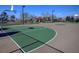 Community basketball and play area featuring multiple courts and playground at 1120 Via Della Curia, Henderson, NV 89011