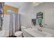 Clean bathroom with a shower-tub combo, white vanity, and ample counter space at 1120 Via Della Curia, Henderson, NV 89011