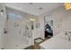 Bright bathroom featuring a glass shower, double sinks, and marble countertops at 1120 Via Della Curia, Henderson, NV 89011