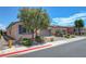 Charming single-story home with manicured landscaping, neutral colors, and three-car garage at 1120 Via Della Curia, Henderson, NV 89011