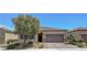 Charming single-story home with a two-car garage, desert landscaping and inviting curb appeal at 1120 Via Della Curia, Henderson, NV 89011