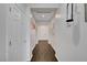Hallway with modern white doors and fixtures with tile floors at 1120 Via Della Curia, Henderson, NV 89011