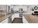 Well-equipped kitchen with stainless steel appliances, granite countertops, tile backsplash, and ample storage space at 1120 Via Della Curia, Henderson, NV 89011