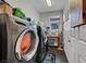 Well-equipped laundry room featuring sleek washer and dryer units, with storage at 1120 Via Della Curia, Henderson, NV 89011