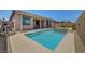 Sparkling pool with water feature and covered patio for outdoor entertaining and relaxation at 1120 Via Della Curia, Henderson, NV 89011