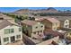 A neighborhood aerial view featuring a two-story home with a landscaped backyard at 1266 Smokey Valley Ln, Henderson, NV 89002