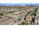 Wide aerial shot of a neighborhood showcasing well-maintained homes and green spaces at 1266 Smokey Valley Ln, Henderson, NV 89002