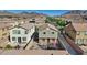 An aerial view of a two-story home featuring a backyard with a patio and trampoline at 1266 Smokey Valley Ln, Henderson, NV 89002