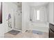 Bathroom with large soaking tub and separate walk-in shower and tile floors at 1266 Smokey Valley Ln, Henderson, NV 89002