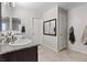 Bathroom featuring a dual vanity with granite countertops and tile floors at 1266 Smokey Valley Ln, Henderson, NV 89002