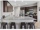 Modern kitchen featuring stainless steel appliances, granite countertops, and a breakfast bar with seating for four at 1266 Smokey Valley Ln, Henderson, NV 89002