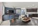 Open living space with a comfortable seating area, dining space, and modern kitchen view at 1266 Smokey Valley Ln, Henderson, NV 89002