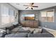 Inviting living room showcasing a large gray sectional, stylish decor, and a bright, welcoming atmosphere at 1266 Smokey Valley Ln, Henderson, NV 89002