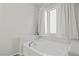 Main bathroom soaking tub with neutral walls, tile floors and recessed shelves at 1266 Smokey Valley Ln, Henderson, NV 89002