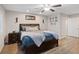 Another main bedroom featuring a ceiling fan, wood floors, and warm paint tones at 1266 Smokey Valley Ln, Henderson, NV 89002
