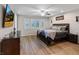 Large main bedroom with ceiling fan, windows, and warm-toned decor at 1266 Smokey Valley Ln, Henderson, NV 89002