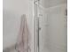 A shower with glass doors and a built-in shelf for bath essentials at 1266 Smokey Valley Ln, Henderson, NV 89002