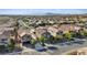 Residential street showing the front of multiple two-story homes with well maintained landscaping at 1266 Smokey Valley Ln, Henderson, NV 89002