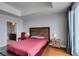 Bright bedroom showcases hardwood floors, wood-paneled headboard, and a bathroom at 150 Las Vegas Blvd # 2115, Las Vegas, NV 89101