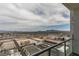 Elevated city view from condo balcony showing rooftops and clear sky above at 150 Las Vegas Blvd # 2115, Las Vegas, NV 89101
