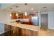 Bright kitchen boasts granite counters, modern lighting, stainless appliances, and wood cabinets at 150 Las Vegas Blvd # 2115, Las Vegas, NV 89101