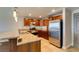 Well-lit kitchen with granite countertops, stainless steel appliances, and wooden cabinets at 150 Las Vegas Blvd # 2115, Las Vegas, NV 89101