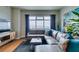 Spacious living room with hardwood floors, modern furniture, and large windows offering beautiful city views at 150 Las Vegas Blvd # 2115, Las Vegas, NV 89101