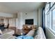 Bright living room featuring a TV, storage, large window and access to other rooms at 150 Las Vegas Blvd # 2115, Las Vegas, NV 89101