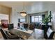Comfortable living room connected to dining area with hardwood floors, a cozy couch, and city views at 150 Las Vegas Blvd # 2115, Las Vegas, NV 89101
