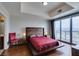 Modern main bedroom with hardwood floors, a platform bed, and floor-to-ceiling windows with city views at 150 Las Vegas Blvd # 2115, Las Vegas, NV 89101