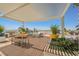 Spacious rooftop patio with sun shade including outdoor kitchen, dining area, and desert views at 150 Las Vegas Blvd # 2115, Las Vegas, NV 89101