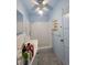 Small blue bathroom with shower and sink at 165 W Alma Ave, Overton, NV 89040