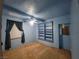 Cozy bedroom with custom painted walls, a ceiling fan, and a window at 165 W Alma Ave, Overton, NV 89040