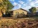 Charming single-story home with rustic wagon wheel accents and mature trees at 165 W Alma Ave, Overton, NV 89040
