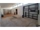 Spacious living room with high ceilings, clerestory windows, and a built-in bookshelf at 165 W Alma Ave, Overton, NV 89040