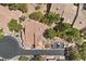 An aerial shot showcasing the terracotta tile roofs and proximity to a community road at 2033 Summer Spruce Pl # 102, Las Vegas, NV 89134