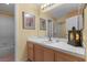Bathroom featuring tile countertops, wood cabinetry, and decorative lighting at 2033 Summer Spruce Pl # 102, Las Vegas, NV 89134