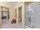 Bright bathroom with glass shower and marble tile flooring at 2033 Summer Spruce Pl # 102, Las Vegas, NV 89134