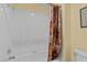 Bathroom with shower and tile surround with decorative shower curtain at 2033 Summer Spruce Pl # 102, Las Vegas, NV 89134