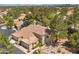 Attractive two-story townhome with a terracotta tile roof and a beautifully landscaped yard at 2033 Summer Spruce Pl # 102, Las Vegas, NV 89134