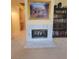 Elegant fireplace with marble surround and built-in bookcase at 2033 Summer Spruce Pl # 102, Las Vegas, NV 89134