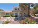 Charming home featuring a well-manicured lawn and colorful flower beds at 2033 Summer Spruce Pl # 102, Las Vegas, NV 89134