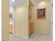 Hallway with storage cabinets, neutral walls, and access to a bathroom at 2033 Summer Spruce Pl # 102, Las Vegas, NV 89134