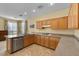 Modern kitchen with stainless steel appliances, granite counters, and ample cabinet space at 2033 Summer Spruce Pl # 102, Las Vegas, NV 89134