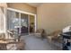 Covered patio with outdoor seating and a grill at 2033 Summer Spruce Pl # 102, Las Vegas, NV 89134