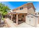Inviting backyard with a covered patio, comfortable seating, and a storage shed, perfect for outdoor living at 2037 Merano Ct, Las Vegas, NV 89123