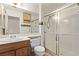 Bathroom with a shower stall, a sink, a mirror, and wood cabinets at 2037 Merano Ct, Las Vegas, NV 89123