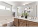 Bright bathroom featuring double sinks, a bathtub, a large mirror and neutral paint at 2037 Merano Ct, Las Vegas, NV 89123
