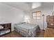 Modest bedroom with neutral colors and a small window providing natural light at 2037 Merano Ct, Las Vegas, NV 89123