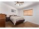 Bedroom features a ceiling fan, wood floors, and a window with blinds at 2037 Merano Ct, Las Vegas, NV 89123